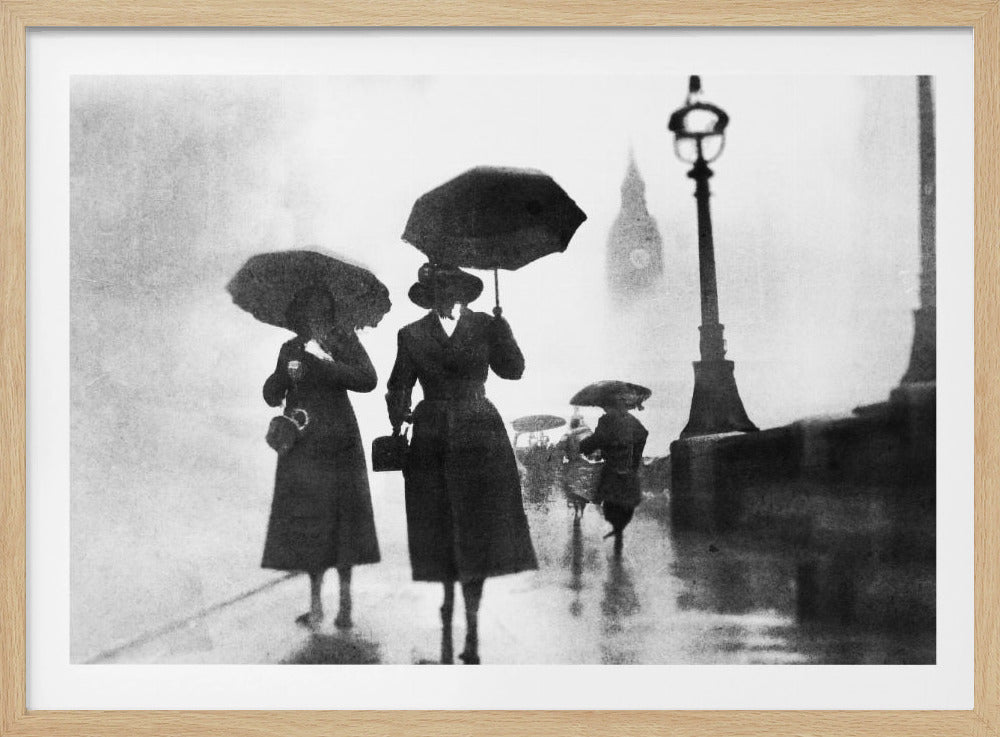 A vintage black and white photograph of people with umbrellas walking on a wet, foggy day in London. The silhouettes of the people are dark against the misty background, where the faint outline of Big Ben and a street lamp are visible. Wall Art