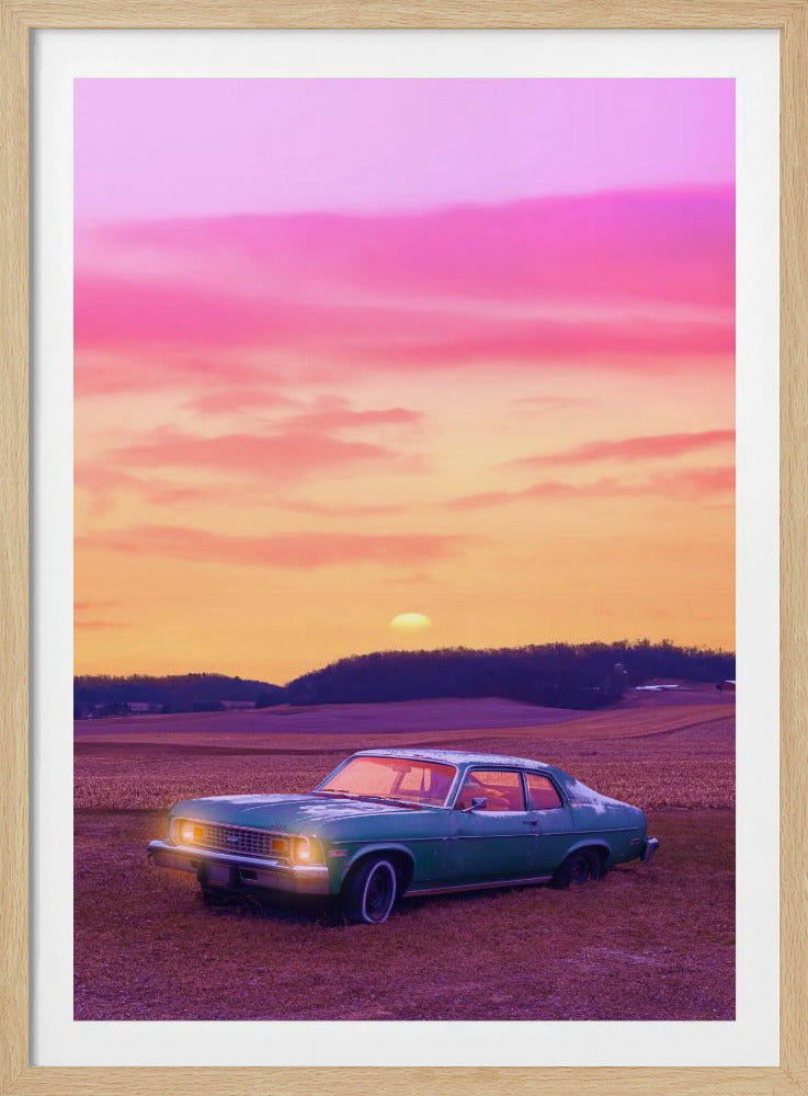 A vintage green muscle car is parked in a purple-hued field under a vibrant sunset sky that blends from orange to a vivid pink. The car's headlights are glowing, and the sun is setting behind distant hills, creating a dreamy, retro atmosphere. Decor