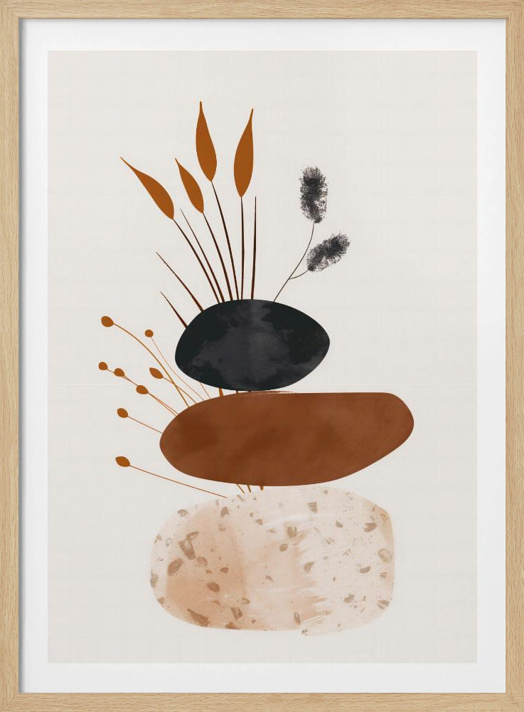 A minimalist abstract artwork featuring a stack of three organic, stone-like shapes against an off-white background, framed in black. The bottom shape is a speckled beige, the middle is a solid terracotta brown, and the top is a textured charcoal black. Various stylized botanical elements, including brown reeds and black fuzzy stems, emerge from behind the stack. Decor