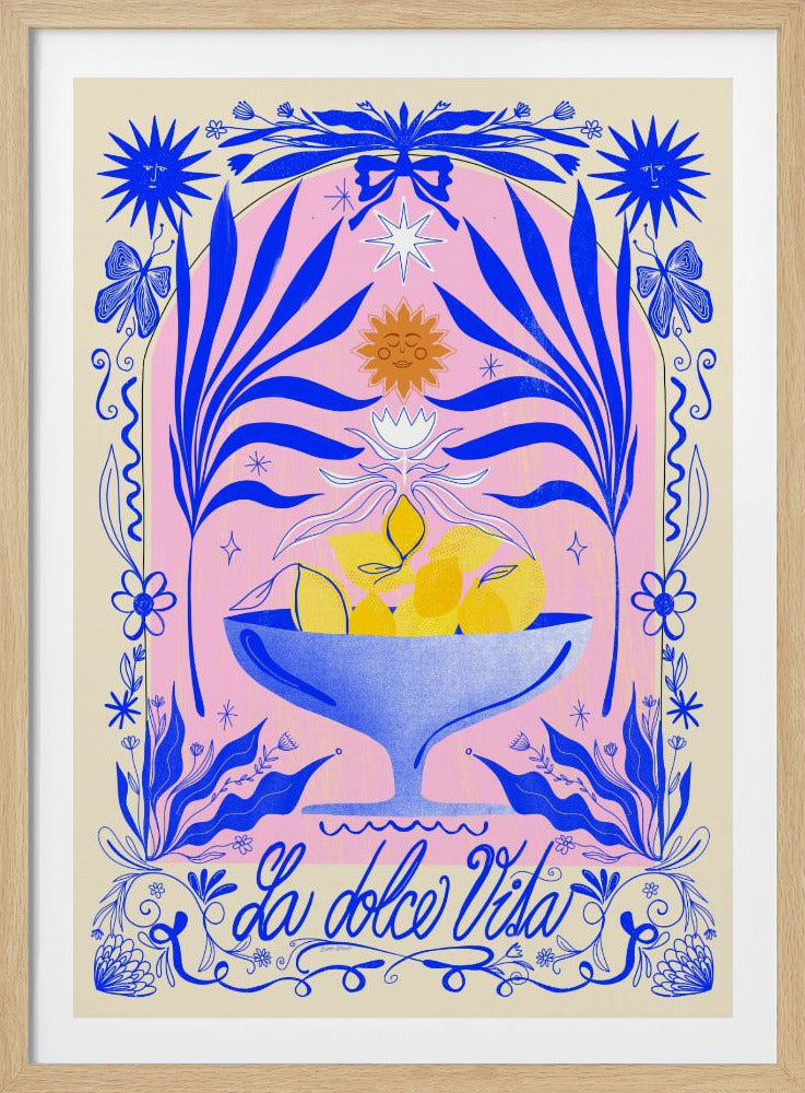 A vibrant, symmetrical illustration featuring a blue bowl of yellow lemons set against a pink arched background. The scene is framed by elaborate blue botanicals, flowers, butterflies, and celestial symbols like suns with faces. At the bottom, the phrase 'La dolce Vita' is written in elegant blue script. Decor