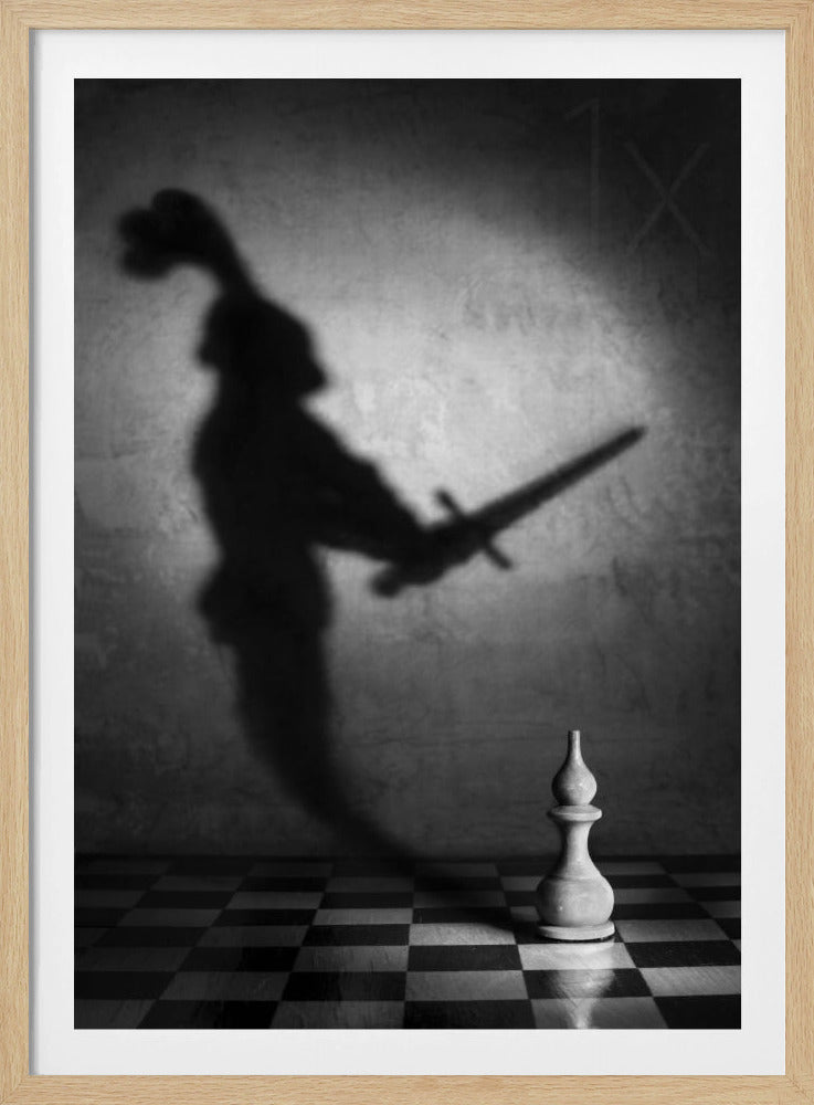 A black and white conceptual photograph of a single white chess piece on a checkerboard, casting a large, ominous shadow of a medieval knight holding a sword against a textured wall. Print