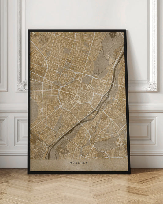 A vintage-style map of Munich, Germany, displayed in a black frame. The map is rendered in shades of brown and beige, with roads and rivers highlighted in white, creating a detailed and artistic representation of the city's layout. At the bottom, the words 'MÜNCHEN' and 'DEUTSCHLAND' are printed. Poster
