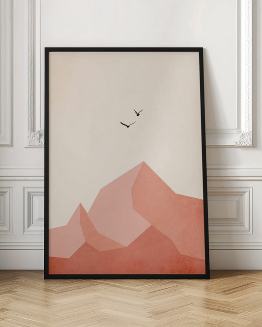 A minimalist framed artwork featuring geometric, faceted mountains in shades of pink and coral against a light cream sky. Two small black birds are shown flying above the peaks, creating a serene and modern nature scene. Wall Art