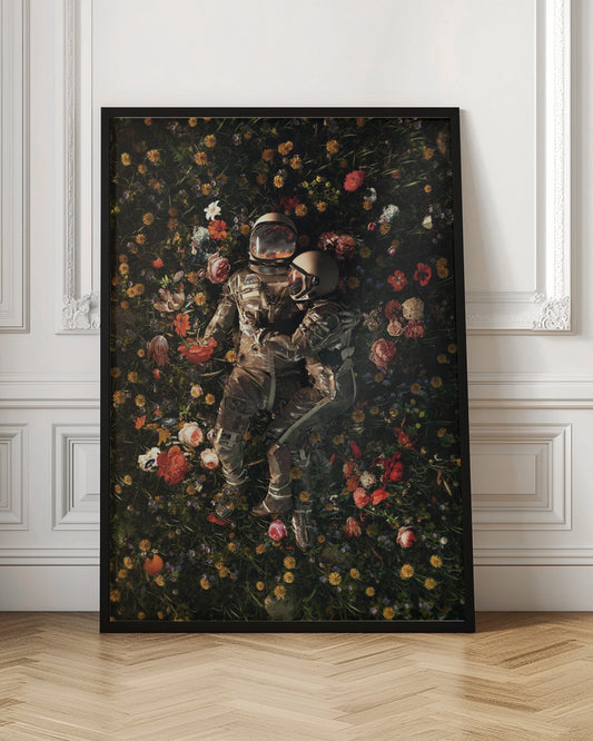 An overhead view of two astronauts in full gear, embracing each other while lying down in a lush, dark field filled with a vibrant array of colorful flowers. Wall Art