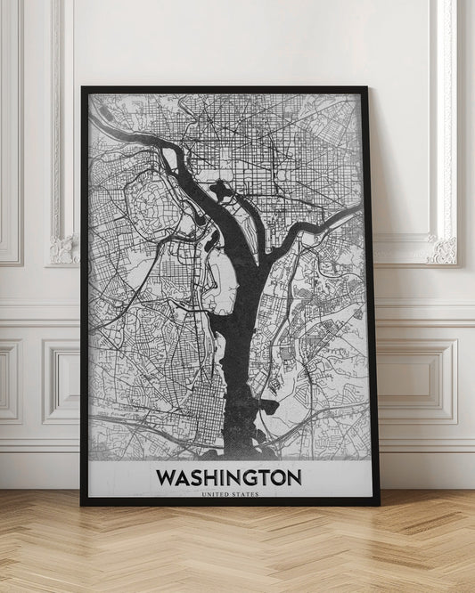 A modern, minimalist black and white map of Washington, D.C., presented as a framed poster. The Potomac and Anacostia rivers are shown in solid black, contrasting with the intricate thin black lines of the city's street grid on a white textured background. The word 'WASHINGTON' is centered at the bottom in bold black text. Artwork