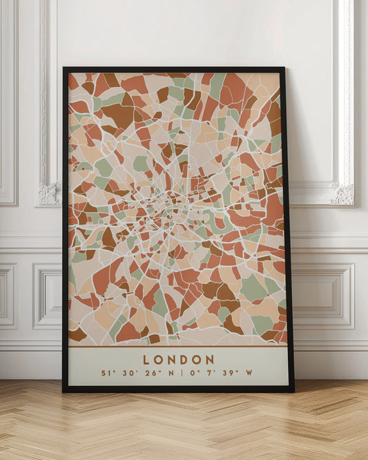 An abstract, framed map of London created with a mosaic of colored shapes in an earth-toned palette of brown, terracotta, sage green, and beige. White lines representing streets separate the shapes, converging towards the city center. Below the map, the word 'LONDON' and its geographic coordinates are displayed on a cream-colored border. Wall Art