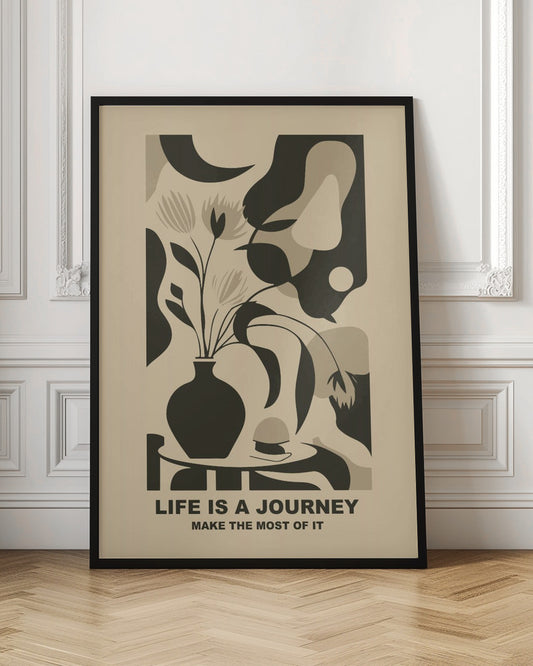A framed abstract art print in a neutral color palette. It depicts a stylized still life with a dark vase of flowers on a table, set against a background of large, organic shapes in beige, taupe, and dark brown. Below the image, the motivational quote 'LIFE IS A JOURNEY' and 'MAKE THE MOST OF IT' is printed in a bold, dark font. Artwork