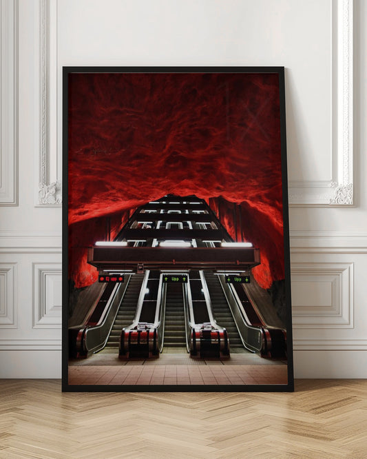 A dramatic low-angle shot looking up a series of escalators in a subway station with a cavernous, rough-textured ceiling glowing an intense, fiery red. Decor