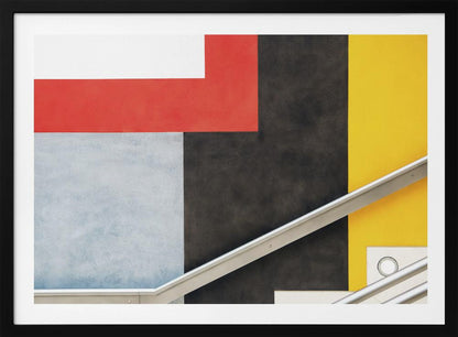 A framed abstract art piece featuring a composition of large, solid-colored geometric shapes in red, yellow, black, white, and light gray. A silver handrail cuts diagonally across the lower portion of the image, adding a sharp line and a sense of architectural space. Artwork
