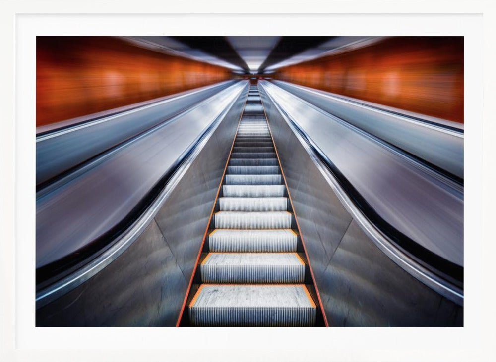 A symmetrical, low-angle photograph looking up a very long escalator, creating a strong sense of perspective towards a vanishing point. The orange walls are motion-blurred, suggesting speed, while the metallic steps in the center remain clear. Decor