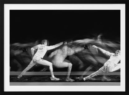 A framed, dramatic black and white photograph using long exposure to capture a fencer in motion. The fencer, in full white gear, lunges forward, their form crisp at the end of the movement while a ghostly blur trails behind, illustrating their rapid advance against a black background. Decor