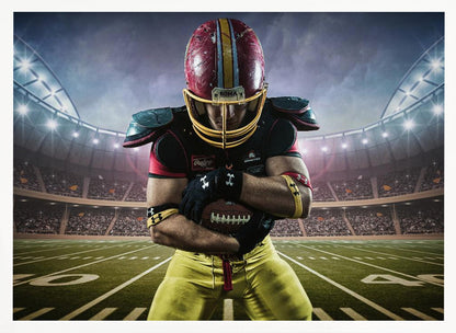A framed poster of a determined football player in a red and yellow uniform standing on a field in a packed stadium. He is holding a football close to his chest with his head bowed, under bright stadium lights. Decor