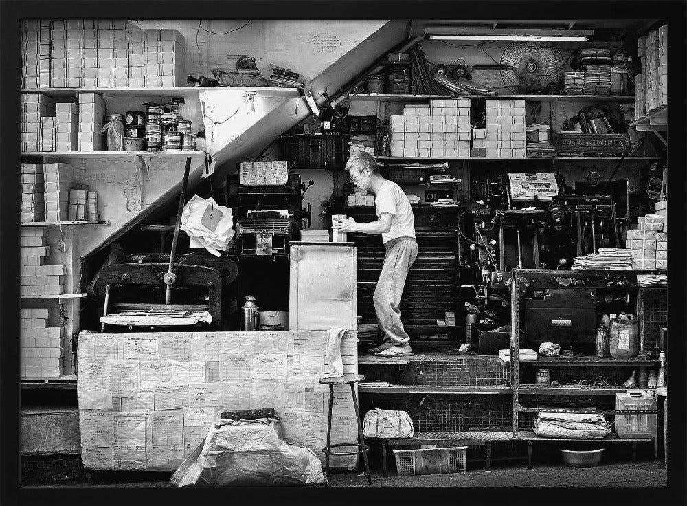 A vintage art print depicting a small, old-fashioned printing shop interior, showcasing antique machinery and a nostalgic atmosphere. Artwork