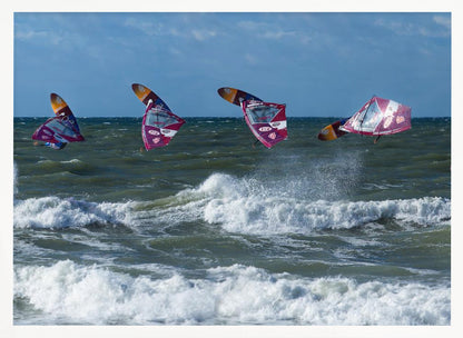 A composite, silver-framed photograph capturing the four stages of a windsurfer's impressive jump over choppy, white-capped ocean waves under a partly cloudy blue sky. Print