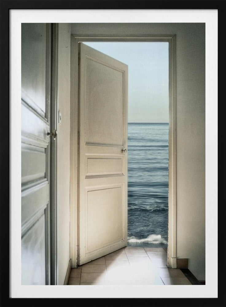 A surreal photograph showing a white interior door swung open, revealing not a landscape but the vast blue ocean, with waves gently washing over the tiled floor of the room. Decor