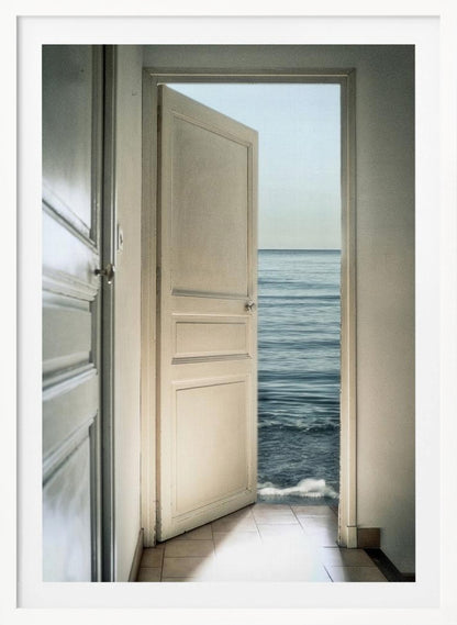 A surreal photograph showing a white interior door swung open, revealing not a landscape but the vast blue ocean, with waves gently washing over the tiled floor of the room. Decor