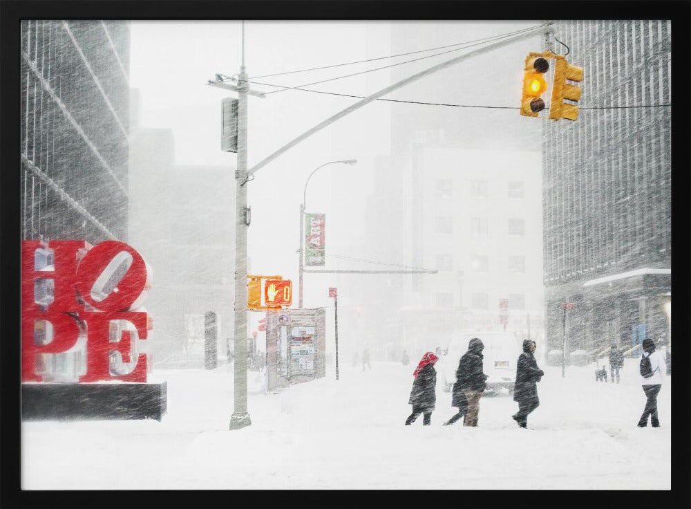 A photograph of a busy city street during a heavy snowstorm. In the foreground on the left, a large, bright red sculpture spells out the word 'HOPE', providing a stark contrast to the muted, white, and gray tones of the snowy scene. Pedestrians in winter coats are crossing the snow-covered street, and tall buildings are partially obscured by the falling snow in the background. Wall Art