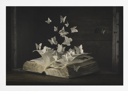 A conceptual artwork depicting an open vintage book on a dark wooden table. Dozens of butterflies, crafted from the book's own printed pages, are emerging and flying upwards as if the story is coming to life against a dark, rustic background. Artwork