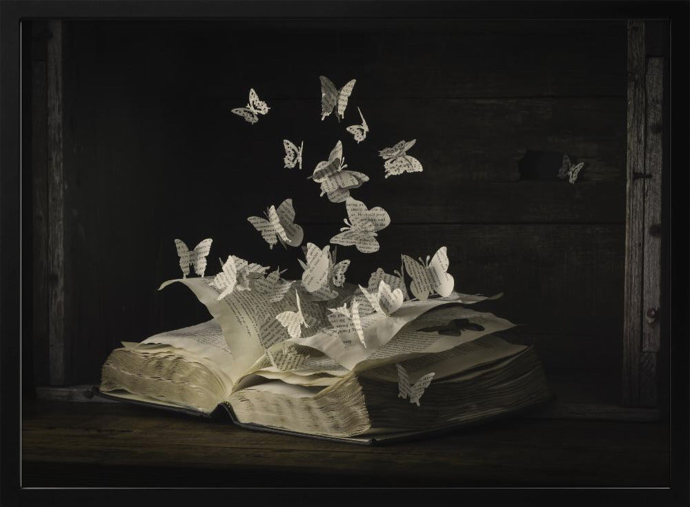 A conceptual artwork depicting an open vintage book on a dark wooden table. Dozens of butterflies, crafted from the book's own printed pages, are emerging and flying upwards as if the story is coming to life against a dark, rustic background. Artwork