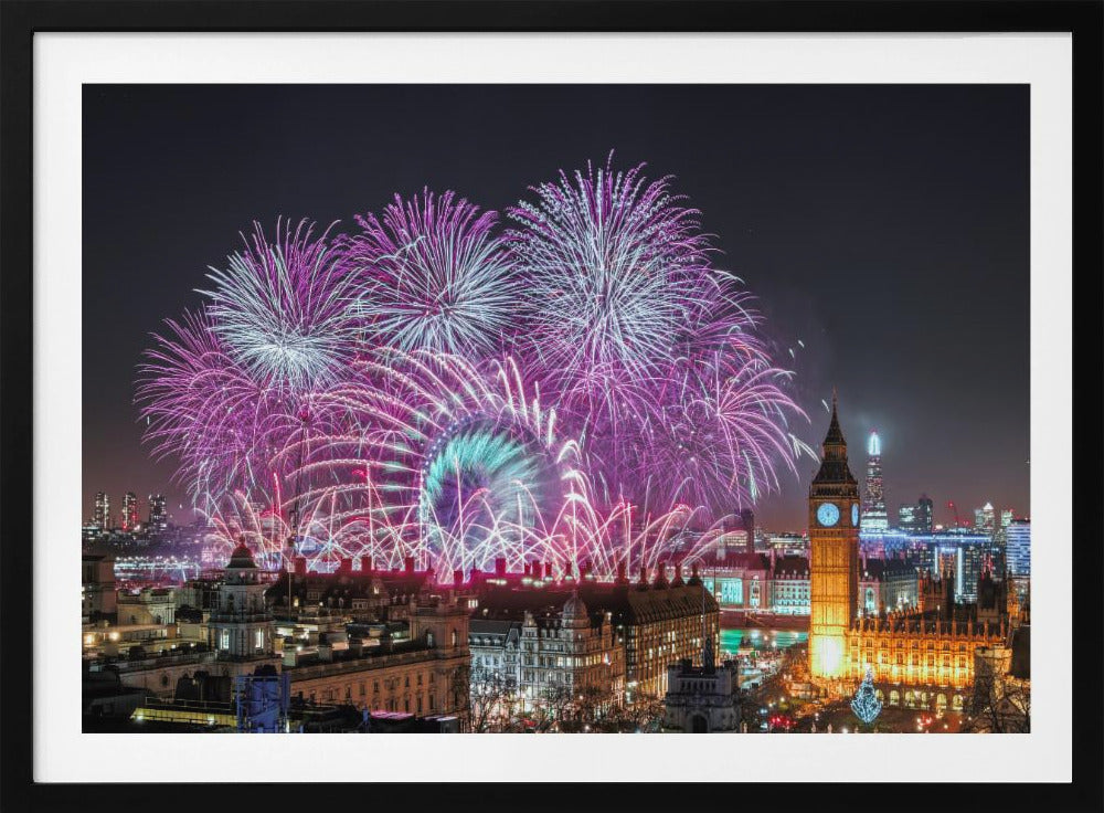 A vibrant night-time cityscape of London featuring a massive fireworks display in purple, pink, and white exploding over landmarks like the London Eye and the illuminated Big Ben clock tower, all within a silver frame. Decor