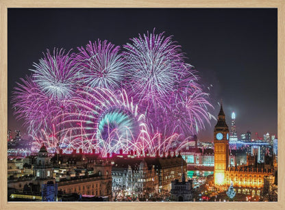 A vibrant night-time cityscape of London featuring a massive fireworks display in purple, pink, and white exploding over landmarks like the London Eye and the illuminated Big Ben clock tower, all within a silver frame. Decor