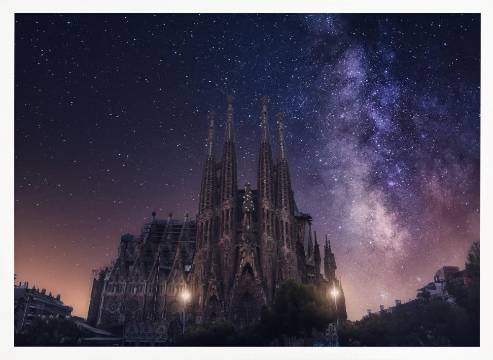 A fantastical night view of the Sagrada Familia in Barcelona, its intricate spires reaching up towards a magnificent, starry sky filled with the purple and pink hues of the Milky Way galaxy, all enclosed in a silver frame. Artwork