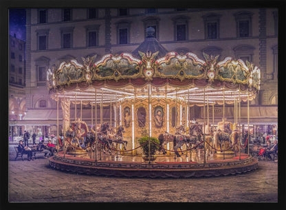 A beautifully illuminated vintage carousel with ornate horses in a European cobblestone plaza at night. The carousel is the central focus, glowing with warm lights against a backdrop of historic buildings and a starry purple sky. Poster