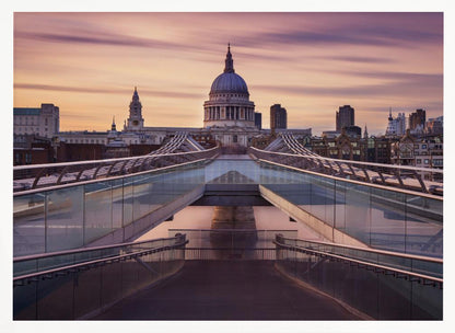 A photograph looking down the center of the Millennium Bridge in London, leading the eye directly to St. Paul's Cathedral, which is centered in the background under a beautiful purple and orange sunset sky. Print