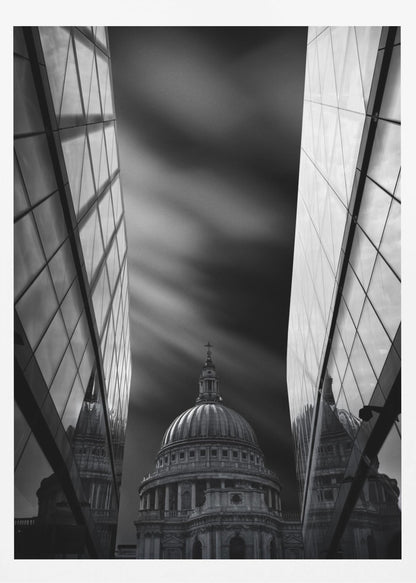A dramatic black and white, low-angle photograph of St. Paul's Cathedral in London, framed between two modern, reflective glass skyscrapers. A long exposure effect blurs the clouds in the sky, creating streaks of light and shadow behind the cathedral's dome. Poster