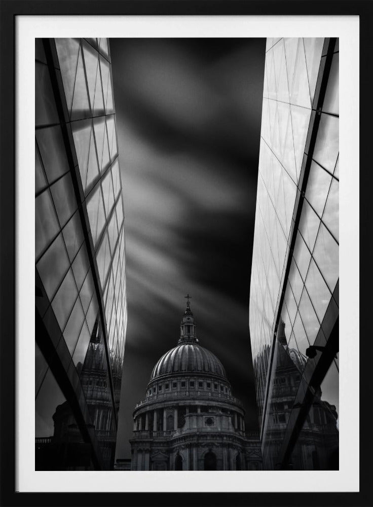 A dramatic black and white, low-angle photograph of St. Paul's Cathedral in London, framed between two modern, reflective glass skyscrapers. A long exposure effect blurs the clouds in the sky, creating streaks of light and shadow behind the cathedral's dome. Poster