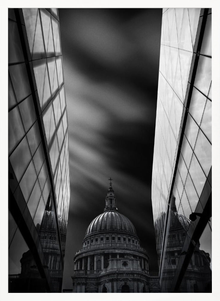 A dramatic black and white, low-angle photograph of St. Paul's Cathedral in London, framed between two modern, reflective glass skyscrapers. A long exposure effect blurs the clouds in the sky, creating streaks of light and shadow behind the cathedral's dome. Poster