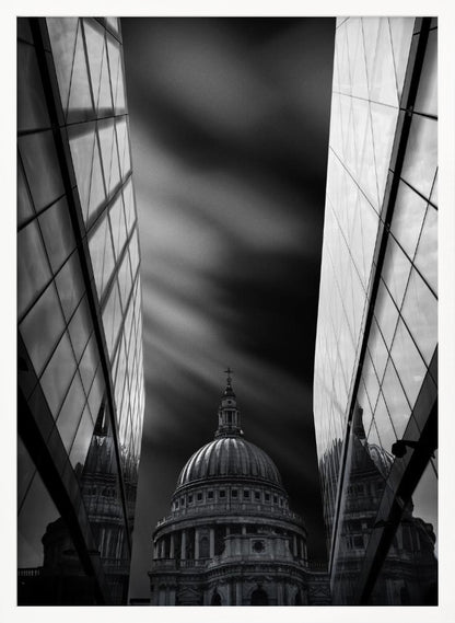A dramatic black and white, low-angle photograph of St. Paul's Cathedral in London, framed between two modern, reflective glass skyscrapers. A long exposure effect blurs the clouds in the sky, creating streaks of light and shadow behind the cathedral's dome. Poster