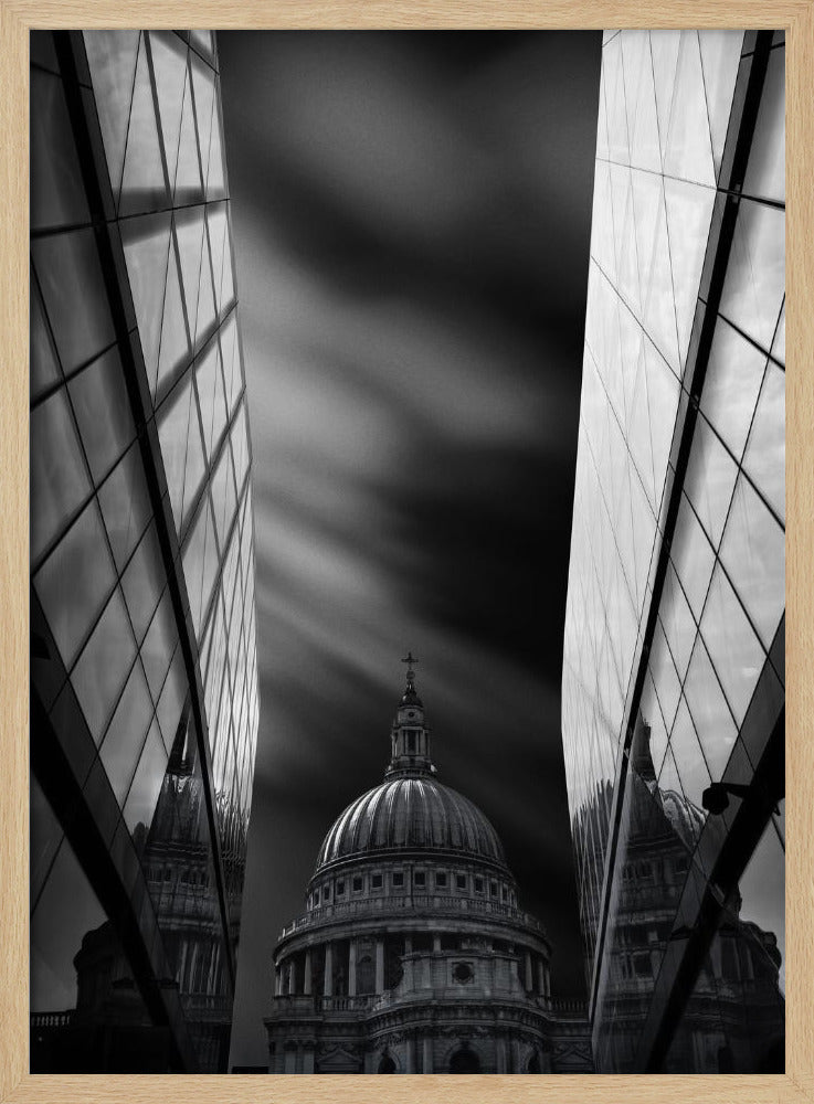 A dramatic black and white, low-angle photograph of St. Paul's Cathedral in London, framed between two modern, reflective glass skyscrapers. A long exposure effect blurs the clouds in the sky, creating streaks of light and shadow behind the cathedral's dome. Poster