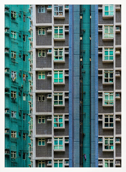 A striking close-up of two densely packed apartment buildings, one with a teal tiled facade and the other with a grey and blue tiled facade, creating a strong pattern of repeating windows and geometric lines. Decor