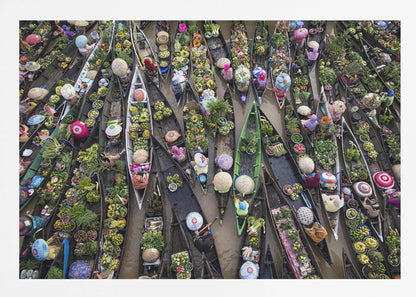 An aerial photograph of a crowded floating market in Southeast Asia, with dozens of narrow wooden boats filled with vibrant green produce and colorful wares on a brown river. Poster