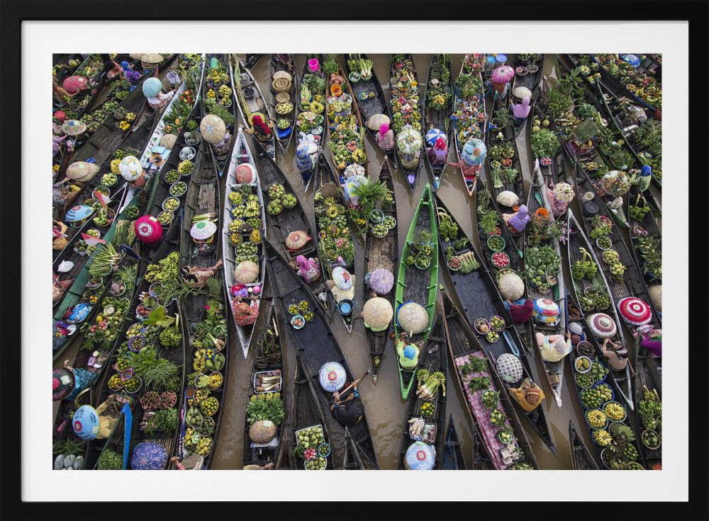 An aerial photograph of a crowded floating market in Southeast Asia, with dozens of narrow wooden boats filled with vibrant green produce and colorful wares on a brown river. Poster
