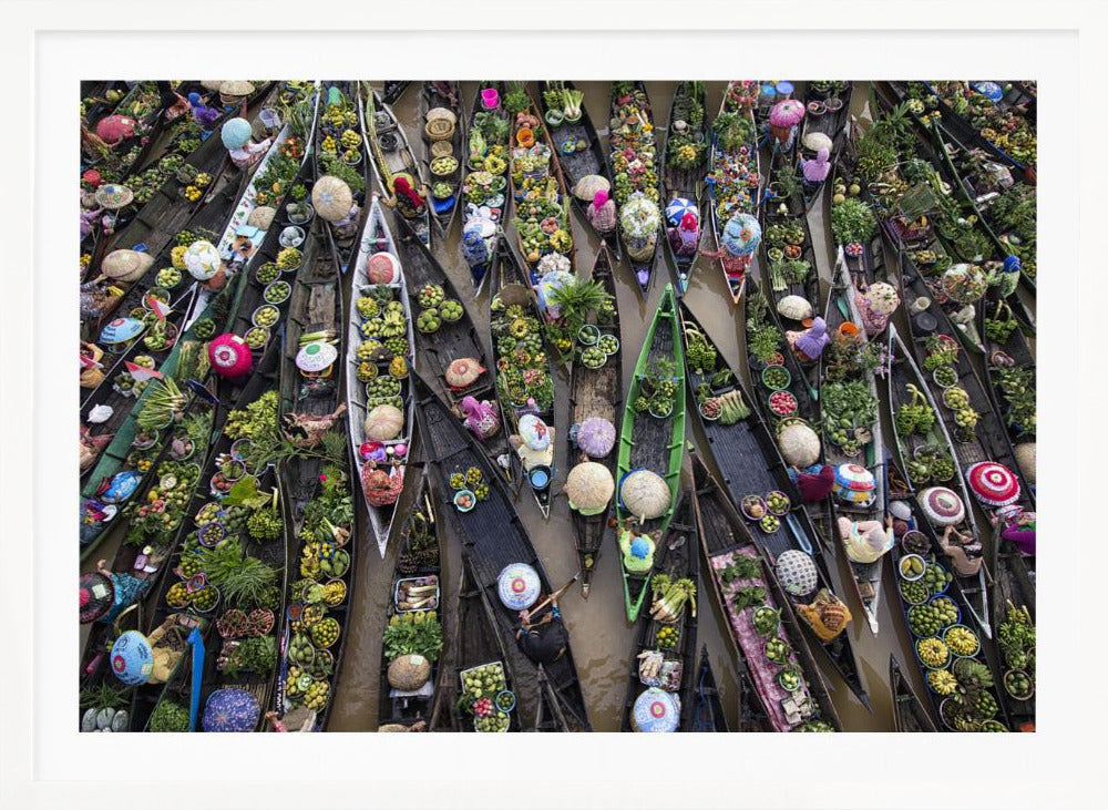 An aerial photograph of a crowded floating market in Southeast Asia, with dozens of narrow wooden boats filled with vibrant green produce and colorful wares on a brown river. Poster