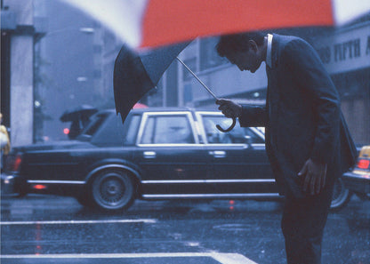 An art print or poster titled 'A bow to the rain' from the 'New York Blues' series, depicting a scene related to rain or a moody New York cityscape, likely featuring blue and grey tones. Poster