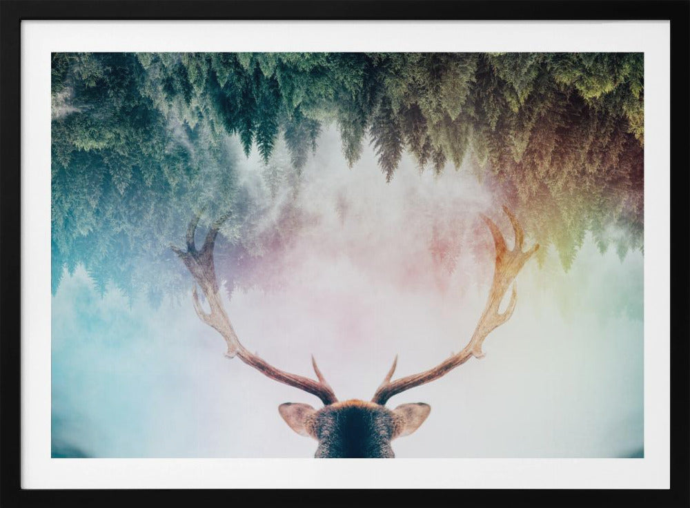 A surreal double-exposure artwork featuring the back of a deer's head with large antlers, blended with an image of a misty pine forest. The forest is reflected above the antlers against a soft, pastel-colored background, all enclosed in a silver frame. Print