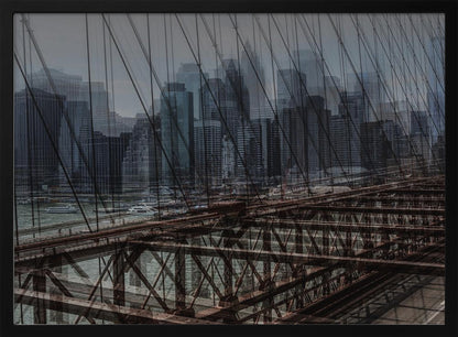 A framed, stylized photograph showing a double exposure of the New York City skyline and the intricate steel structure and cables of the Brooklyn Bridge, creating a dense, layered urban scene with a cool, moody color palette. Decor