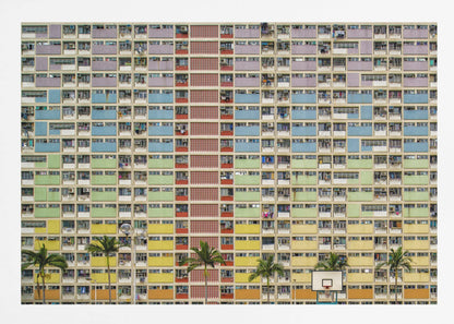 A symmetrical, frontal photograph of the colorful Choi Hung Estate in Hong Kong, featuring a massive grid of apartments with balconies painted in a rainbow of pastel colors including purple, blue, green, yellow, and orange. Palm trees and a basketball court are visible at the base of the building, which is enclosed in a silver frame. Wall Art