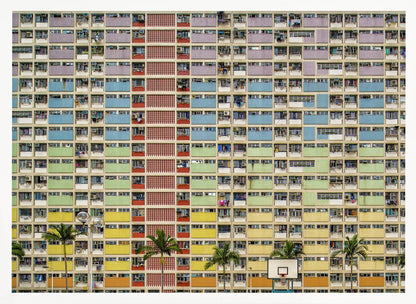A symmetrical, frontal photograph of the colorful Choi Hung Estate in Hong Kong, featuring a massive grid of apartments with balconies painted in a rainbow of pastel colors including purple, blue, green, yellow, and orange. Palm trees and a basketball court are visible at the base of the building, which is enclosed in a silver frame. Wall Art