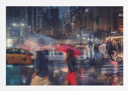 An artistic motion-blur photograph of a rainy night on East 42nd Street in New York City. Pedestrians with umbrellas, one with an American flag design and another bright red, cross the wet street as city lights and a yellow taxi reflect on the pavement, creating a vibrant, impressionistic scene within a silver frame. Decor
