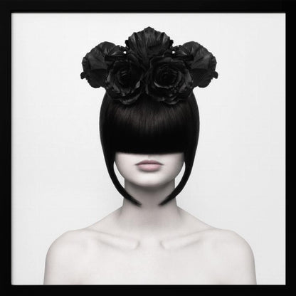 A stylized black and white portrait of a woman with a sleek black bob hairstyle where the bangs completely cover her eyes. She wears a large, elaborate headpiece made of black roses. Her expression is neutral, showing only her mouth and chin. The image is set against a plain white background and enclosed in a light wood frame. Print