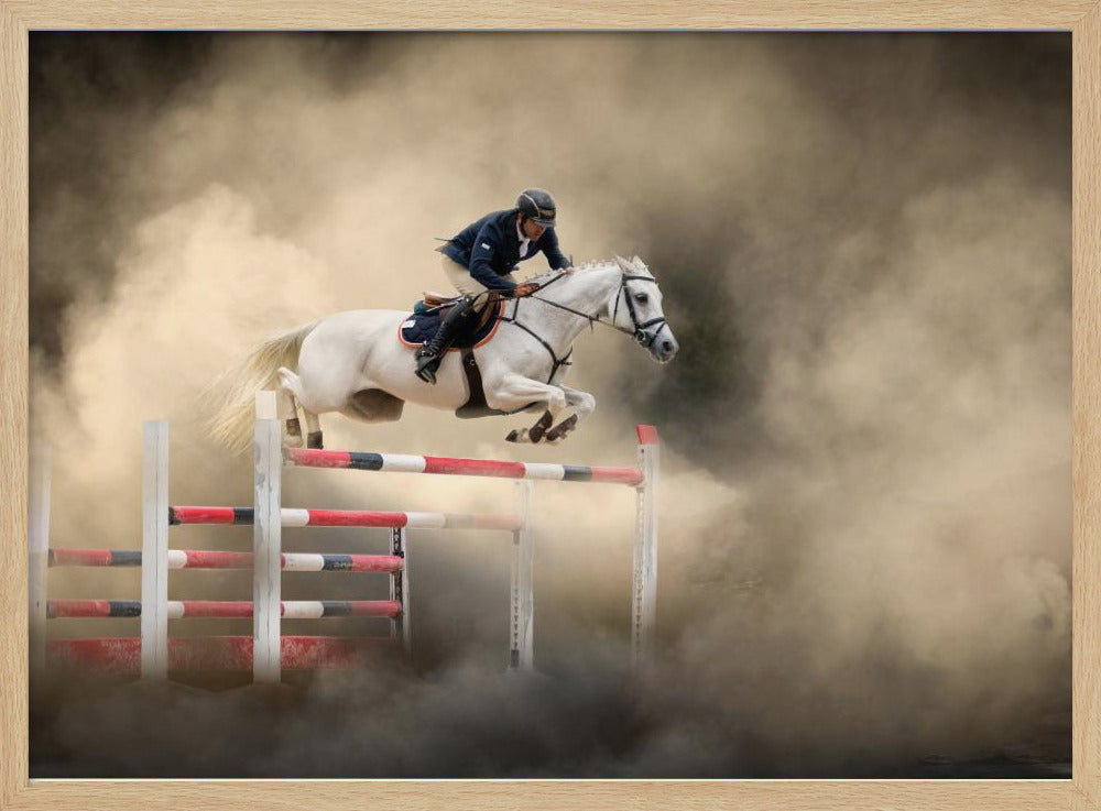 A dramatic action shot of a person in a blue jacket and helmet riding a powerful white horse as it leaps over a red and white striped obstacle, all enveloped in a swirling cloud of brown dust. Print