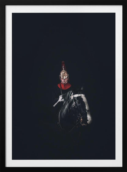 A dramatic portrait of a British Royal Guard on a black horse, emerging from a completely black background. The guard is wearing a traditional uniform with a red collar and a shiny gold helmet with a red plume. Poster
