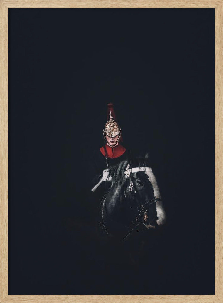 A dramatic portrait of a British Royal Guard on a black horse, emerging from a completely black background. The guard is wearing a traditional uniform with a red collar and a shiny gold helmet with a red plume. Poster