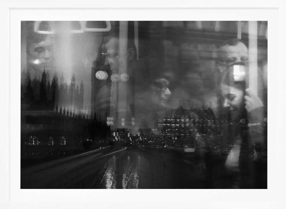 A moody black and white double exposure photograph showing a rainy London street at night with Big Ben, overlaid with the faint reflections of people inside a moving vehicle like a bus. The image has a dreamy, layered effect and is displayed in a silver frame. Print