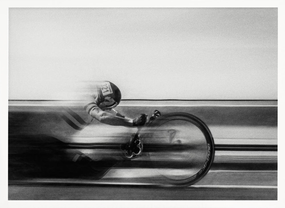 A black and white photograph captured with motion blur, showing a cyclist in an aerodynamic position racing at high speed. The background is blurred into horizontal lines, emphasizing the velocity. The image is enclosed in a silver frame. Wall Art