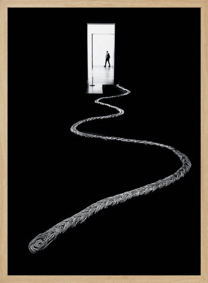 A high-contrast, black and white photograph of a thick, silver, braided rope winding across a black floor, leading towards a brightly lit doorway in the distance where a silhouetted man is walking away. Wall Art